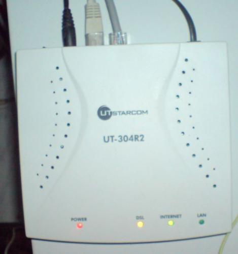 utc adsl modem on operation - This is a typical ADSL modem connectet to an an ethernet. Fixed telephone wire jack rj11 is connected into the rj11 jack of the ADSL modem. an ethernet cable is also connected into RJ45 jack. A Filte/splitter is needed to sepatare the two signal bands freqwuencies