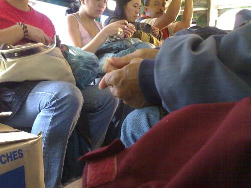 Inside a Jeepney - A publice utility vehicle in the Philippines. A larger version of a WW II jeep. Passenger sits side by side.