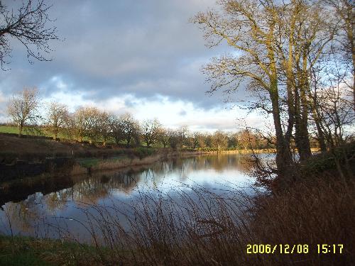 View of Barrhead Dams. - This pic was taken in the winter sun in December with a samsung digimax i5 camera and is as was taken.

Barrhead Dams are in Scotland, just South of Glasgow on the Barrhead to Newton Mearns road and it is man made from what was once a small stream that ran through the hills.

The water from the dam supplies the residents on the south side of Glasgow.