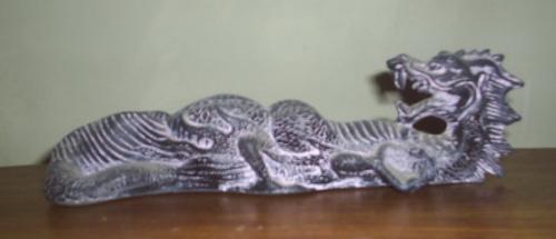 A ceramic dragon - A Chinese Dragon incense holder.