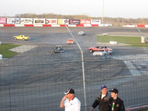once again a close call - A shot of the action at the 'Crossraods Of Doom' in the figure 8 race. Taken at Elko Speedway in Elko Minnesota USA 4-21-07.  This was a special event called Eve of Destruction.