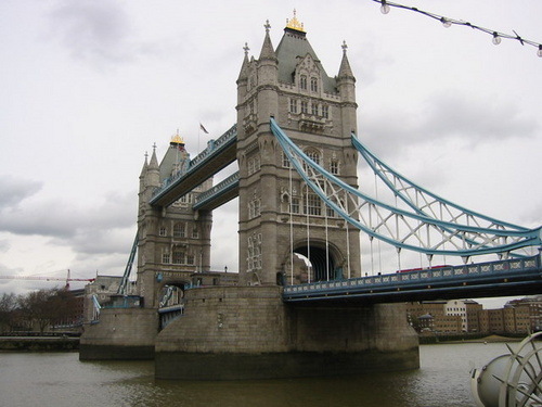 London Tower Bridge - The London Tower Bridge is a combined bascule and suspension bridge in London, England; over the river Thames. It is close to the Tower of London, which gives its name. It has become an iconic symbol of London with a length of 244m!!!