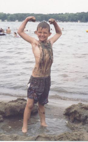 Boy & Mud - Young boy, my youngest, at the beach showing off after covering himself in mud.