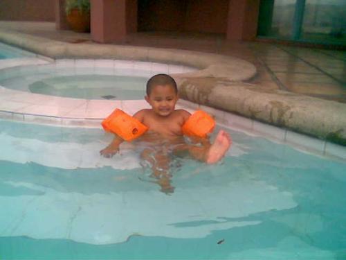 summer splash - my little bear having a fun time at the pool