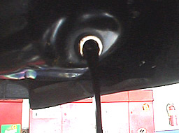 oil change - oil draining from car