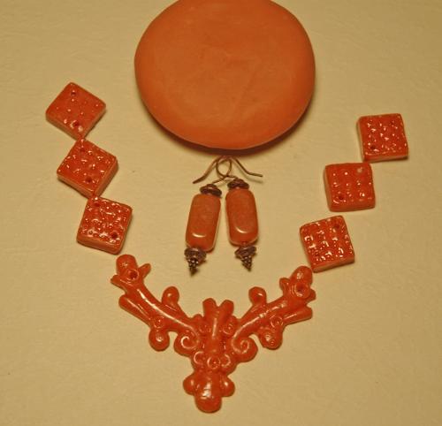 Aventurine - Real and Faux - The earrings in the center are the real deal, the rest of it is my own creation. The blob on the top is what it looks like before it was molded and baked and finished. That's what I like best about polymer clay - you can do soooo much.  www.bibelots.etsy.com