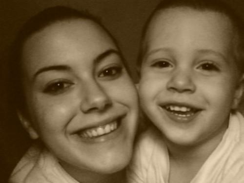 Lo-Lo and Evan - This is me ((LoLo)) and my nephew Evan, he will be three years old July 5th, 2007. I love this picture. There is a glass counter where I work and I put it underneath it. Everyone who notices it says I look beautiful.