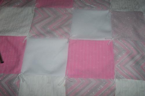 Baby's First Quilt - This is a quilt given to me by a local agency who gave me a layette set. I like the silver in it. I can't wait to see how the baby looks sleeping with it.