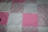 Cute quilt - How cute is this quilt? It looks as if it were made with a piece of clothing from the 70's with the silver in it. I don't know but I like it. I never realized how cute pink and silver look together.