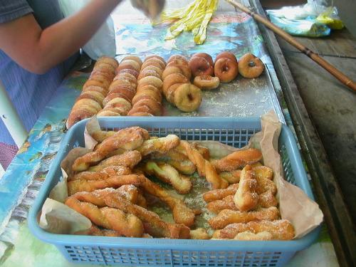 donuts and bread twisters - donuts and bread twisters snacks sold, fly repeller to keep flies away.