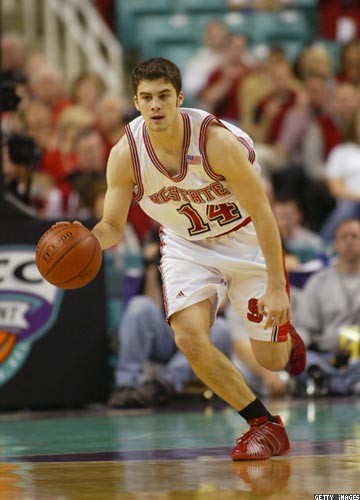 Nc State Player - Engin Atsur - Atsur is dribbling the ball down the court.