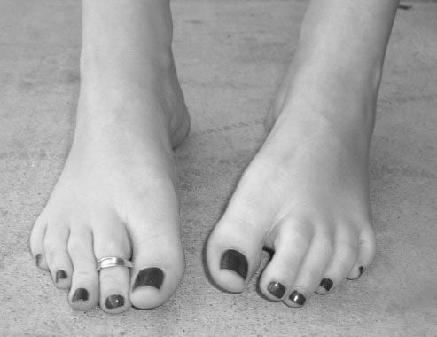 Feet in Black and White - This is a simple black and white photograph depicting someone's feet.