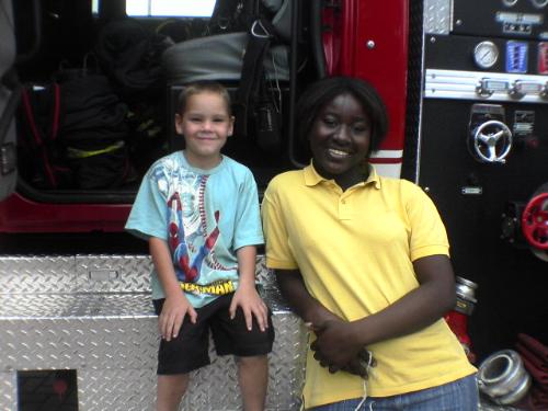 Fire Truck - December 2006 - Esther and Wezi at a fire truck - first time for both of them