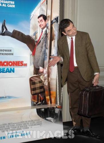 Mr. Bean - Mr. Bean standing beside his poster