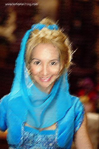 Genie - Thanks to photoshop. I was able to to put my face at Alyssa Milano's body. The photo was taken on one of the scenes in Charmed wherein Phoebe was turned to a genie.