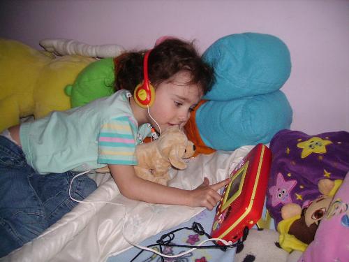watching tv - my daughter watching her portable dvd player