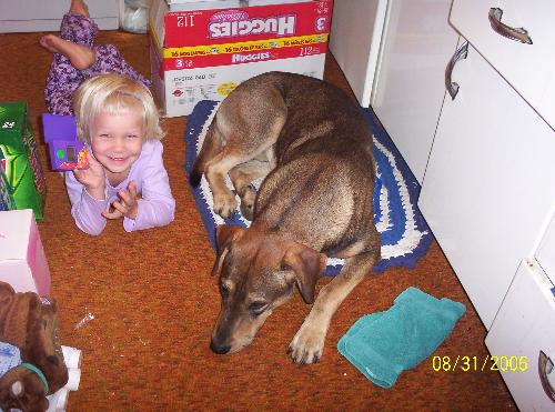 Duke and Madison - My dog duke and my daughter madison laying on the floor of my kitchen