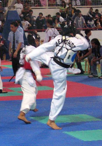 kick! kick! kick! - it is on a national competition. im one wearing the blue armor delivering a 45 degrees kick. i won in this match but sadly i only got the bronze medal coz i was owned in my next match with 1 point lead *_*