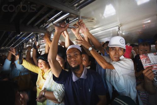 in a train - economy class passengers on jakarta's train