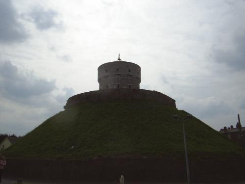 Martello - than 1808 when the Martello Tower was constructed on the site.   The story goes that it was originally a passage grave and according to one legend it is the burial place of Amergin, an early Celtic poet. One story records that Amergin of the Fair Knee, a warrior bard in the army of Milesius was the first of the Bronze Age settlers to set foot on Irish soil.  Others sources claim that Amergin first set foot on Kenmare Bay around 2,000 BC and if as we are lead to believe the Milesians arrived from Spain, this would seem more likely.   Another legend claims Queen Scotia, wife of Milesius, the daughter of an Egyptian Pharaoh is also buried here. But a counter-claim suggests she travelled from he native land to south Kerry, where she met the invader Milesius, married him and had eight sons by him and was buried at Glenscoheen overlooking Tralee Bay.