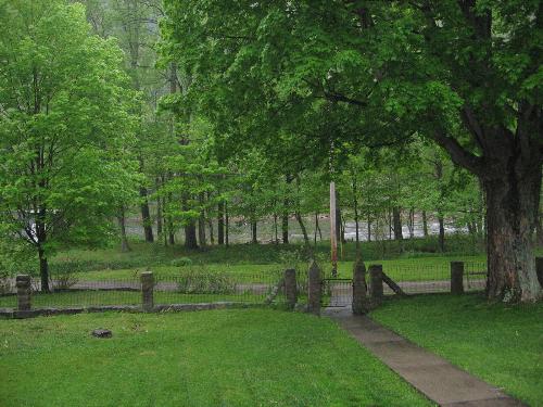 View from my swing on the front porch - The leaves are turning green and the water is looking inviting. We had a fisherman catch a fish yesterday from this river that you are looking at. It is dusk now so it is a little dark to view. I hope you enjoy it.