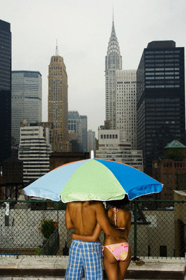 couple on the rooftop - couple under sunshade on rooftop