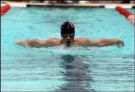 Swimming - A guy who is swimming the stroke called butterfly