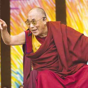 Dalai Lama  - The Dalai Lama laughs and points to the crowd as he speaks at the Chicago Millennium Park on Sunday. The Tibetan Buddhist leader and head of the Tibetan Government-in-exile is on his final stop of a 14-day US visit.