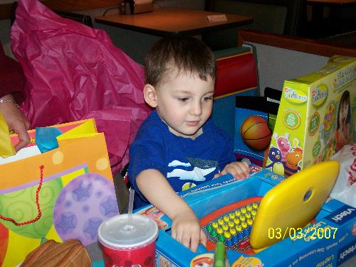 birthday fun - my son on his 3rd b-day at chuck e cheese's this past march. what a haul!!