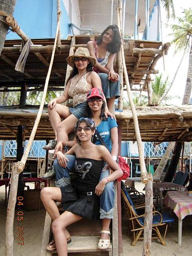 Coco huts on Palolem beach, Goa - All four of us on the stairs of our coco hut which is on the beach facing the sea. I am right at the top.