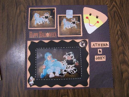 A page from my younger daughter&#039;s book - A scrapbook page layout for my toddler for her first Halloween. The layout is in her scrapbook which is just one of many scrapbooks I have made.