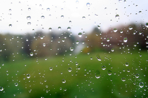 Raindrops on the Window - image of a window with raindrops from the rain shower.