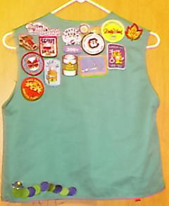 Back of Girl Scout Vest - Here are the patches on the back of her vest. This is only part of them. Only the best make it to the vest, others are put in a photo album.