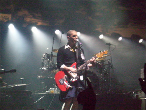 Brian Molko of Placebo - Placebo live in Glasgow 2006.  He's wearing a skirt, yes, a full school girls outfit.