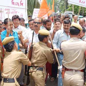 Police personnel obstructing  - Police personnel obstructing the BJP rallyists holding a dharna against the delimitation process in Guwahati, India.