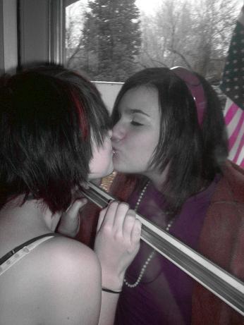 A kiss is just a kiss - Teens kissing the window