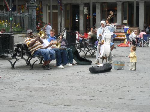 jazz musicians - a group of musicians playing music for passersby in Jackson Square in New Orleans