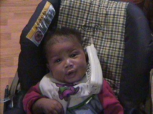 My son - He is two months in this picture and tryna talk on the phone. He was talkin to his Nana.