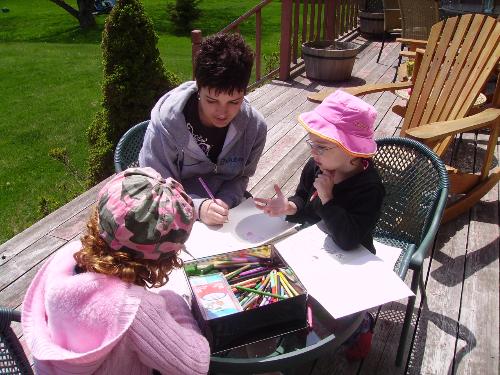 colouring outside - kids colouring outside ont he porch