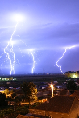 Lightning over Oradea, Romania - Lightning over the outskirts of Oradea, Romania, during the August 17, 2005 thunderstorm which went on to cause major flash floods over southern Romania. Text and image from http://en.wikipedia.org/wiki/Image:Lightning_over_Oradea_Romania_2.jpg . Image is public domain according to information presented on referenced page.