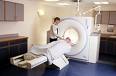 health - A pacient going into the cat scan machine.
