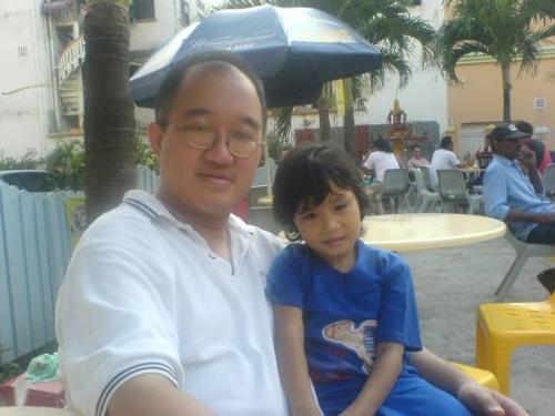 The Street Urchin - Picture of me with a street urchin in Geylang, Singapore's Red Light District