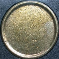 A planchet - A planchet is a prepared disc-shaped metal blank onto which the devices of a coin image are struck or pressed. The metal disc is called a blank until the time it passes through the upsetting machine which causes the rim to be raised. Once it has a rim, the disc is called a planchet.