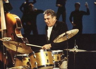 Gene Krupa, Great Jazz Drummer - picture of Gene Krupa sitting at his full set of drums. Considered by many to be one of the all time great jazz drummers in the world.