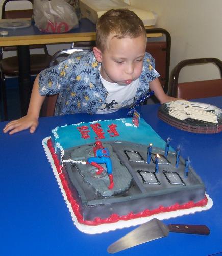 Blowing out the candles - Alex blowing out his candles on his birthday cake.
