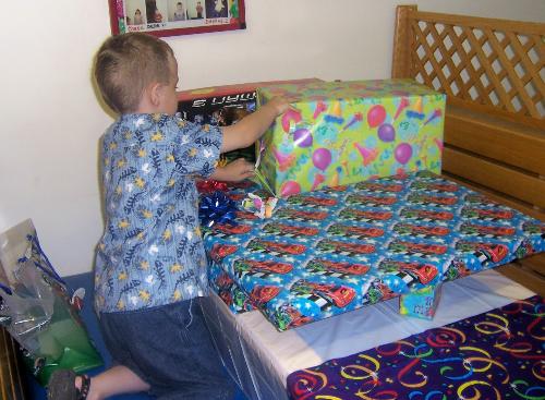 Time for the Presents - Alex opening presents at his fifth birthday party.