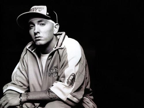 Eminem Pics - Born Marshall Bruce Mathers III on October 17, 1972, in Kansas City, Missouri. Spent childhood moving back and forth between Kansas City and Metro Detroit. Attended Lincoln High School in Warren 1986-89. Hustled self-made cassettes of his work to places like Record Time in Roseville. His girlfriend (now wife) Kimberly gave birth to daughter Haile Jade on Dec. 25, 1995. He worked at Gilbert's Lodge (a family restaurant) in St. Clair Shores from 1996-1998. Full-length debut, Infinite, released in 1996. The Slim Shady EP was released in 1998. Later that year, Dr. Dre signed Eminem to his Aftermath label after hearing the rapper free styling on a Los Angeles radio station. The Slim Shady LP was released on Feb. 23, 1999 and hit No. 2 on the Billboard charts within weeks. The Slim Shady LP was 3 times platinum. Eminem has now put out his second full length CD, entitled The Marshall Mathers LP.