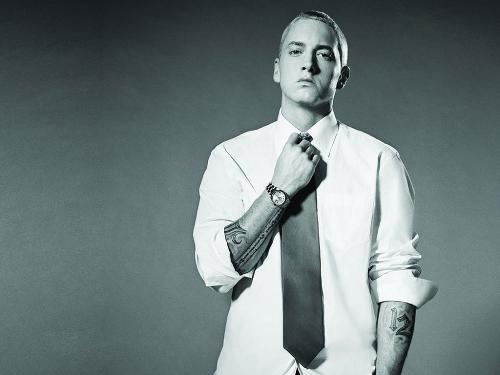 Eminem Pics - Born Marshall Bruce Mathers III on October 17, 1972, in Kansas City, Missouri. Spent childhood moving back and forth between Kansas City and Metro Detroit. Attended Lincoln High School in Warren 1986-89. Hustled self-made cassettes of his work to places like Record Time in Roseville. His girlfriend (now wife) Kimberly gave birth to daughter Haile Jade on Dec. 25, 1995. He worked at Gilbert's Lodge (a family restaurant) in St. Clair Shores from 1996-1998. Full-length debut, Infinite, released in 1996. The Slim Shady EP was released in 1998. Later that year, Dr. Dre signed Eminem to his Aftermath label after hearing the rapper free styling on a Los Angeles radio station. The Slim Shady LP was released on Feb. 23, 1999 and hit No. 2 on the Billboard charts within weeks. The Slim Shady LP was 3 times platinum. Eminem has now put out his second full length CD, entitled The Marshall Mathers LP.