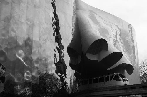 EMP in Seattle - This is the Experience Music Project in Seattle. The monorail goes through the inside of the buiding. Also you can see the reflection of the space needle of the building.
