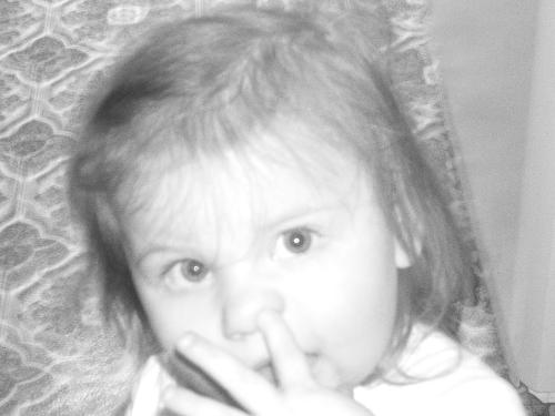 almost got it - a great blackmail picture to show her boyfriend when she's older. My 2 year old caught in the act of picking her nose LOL Isn't she adorable :)